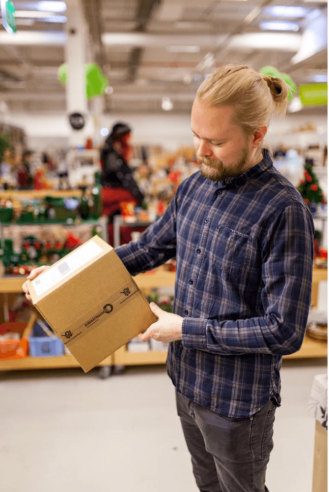 A man holding an online store shipment